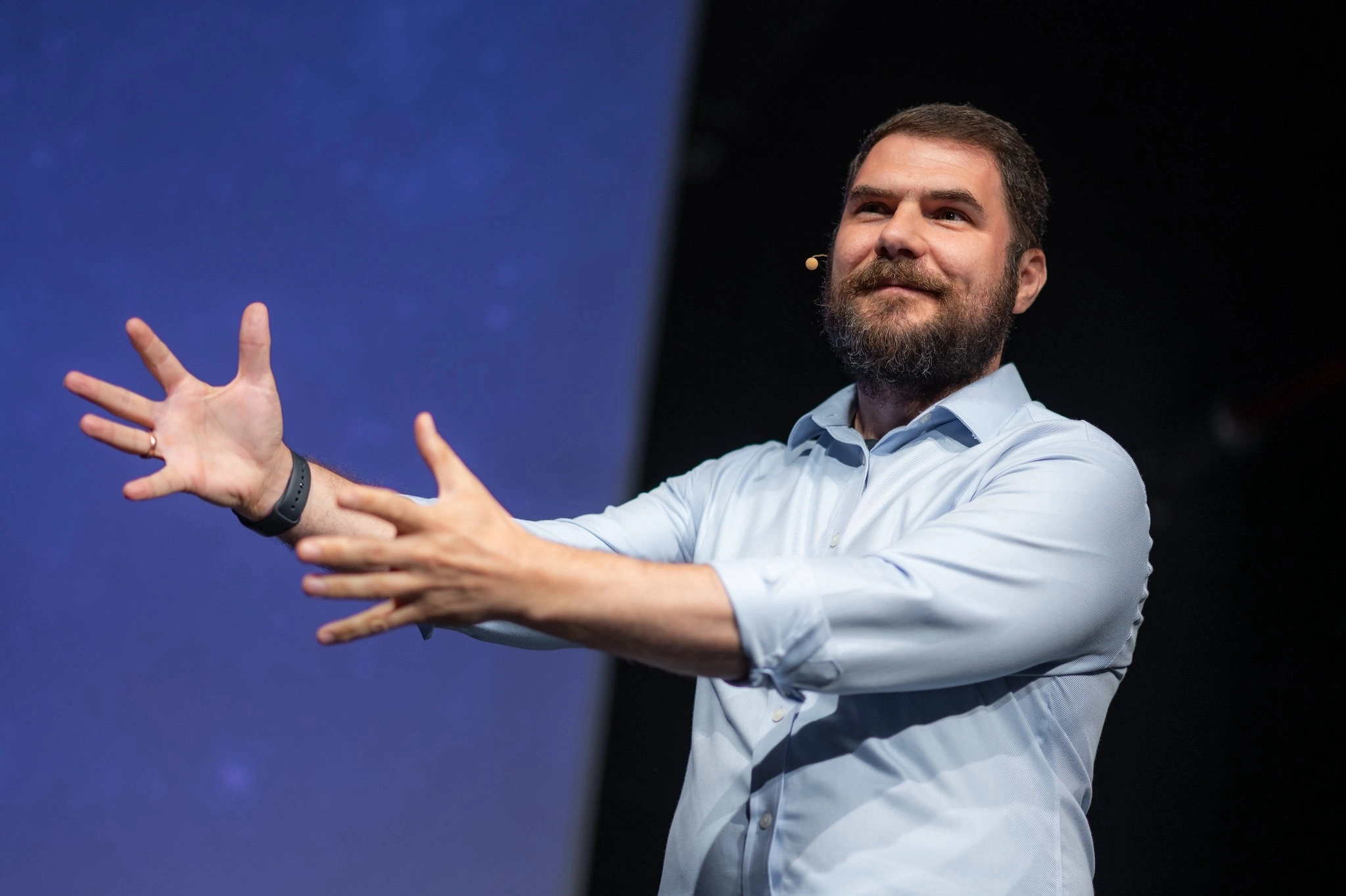 Image with Lucian Ghinda speaking at a conference